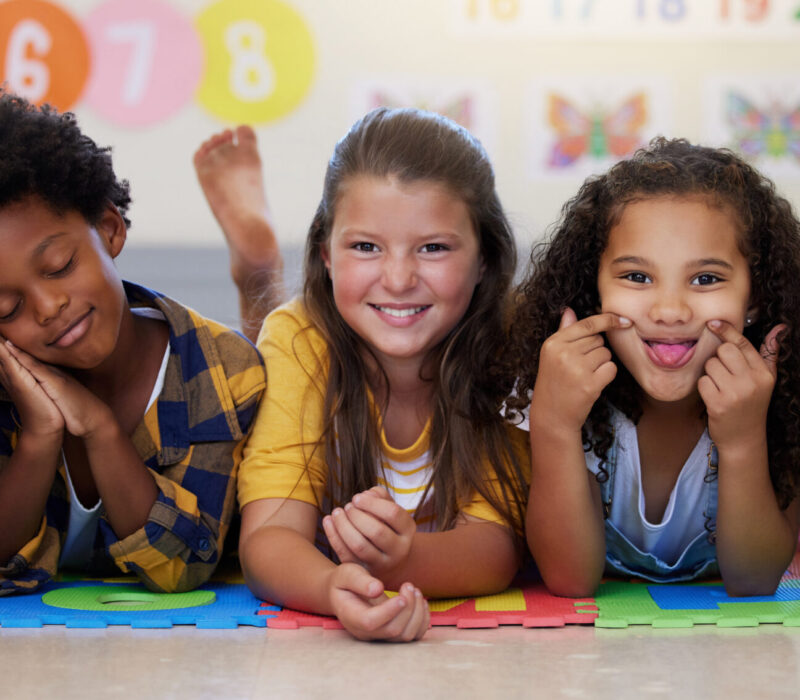 kids-floor-group-portrait-with-funny-face-school-classroom-solidarity-diversity-childhood-girl-boy-children-class-academy-happy-multicultural-friends-together-playful